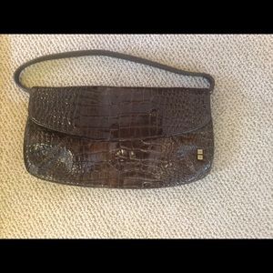 Brown leather crocodile clutch